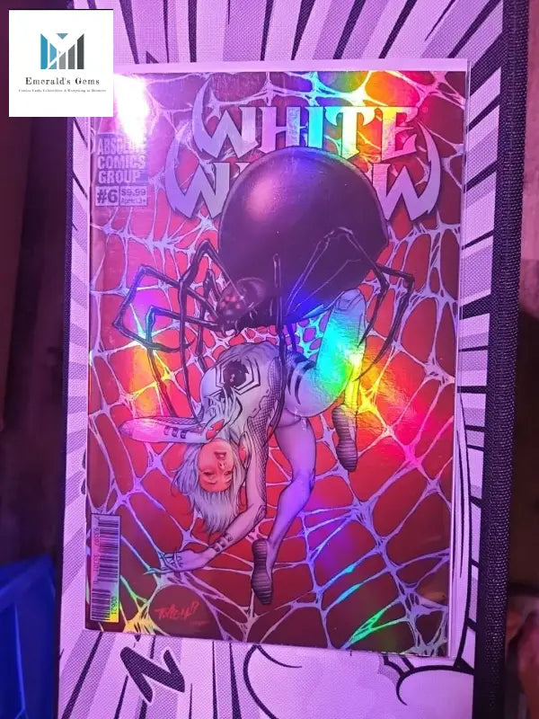 Person Holding White Widow Comic Book #6 with Spider on Dazzling Foil Cover by Tim